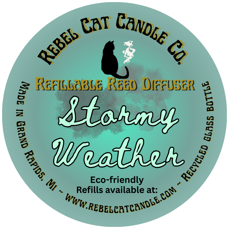 Round label for Rebel Cat Candle Co. refillable reed diffuser 'Stormy Weather' on a teal background.